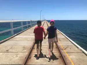 girl boy holding hands at bussleton jetty
